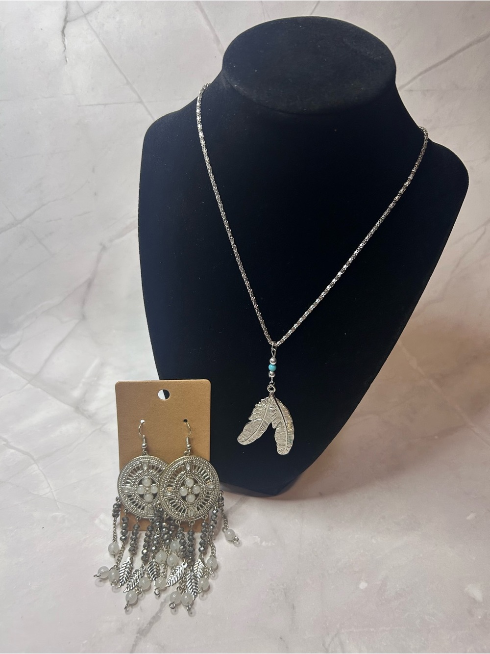 Silver Tone Feather Pendant Necklace and Statement Earrings Set